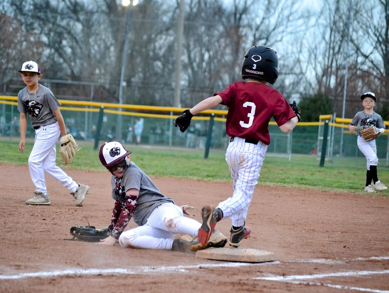 Warriors player sliding into base